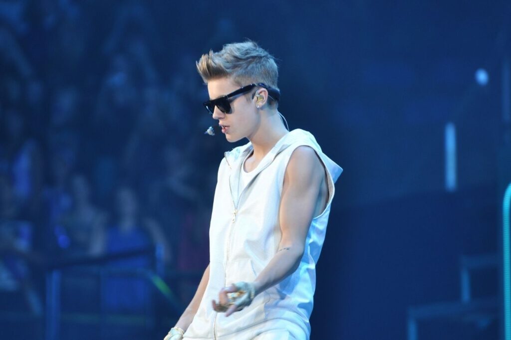 Justin Bieber performing live during the Believe Tour while promoting the Believe Deluxe Edition album.