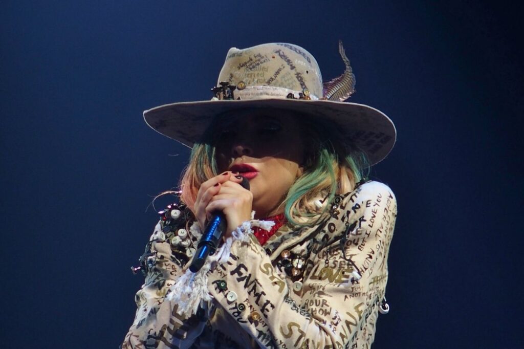 Lady Gaga performing live during the Joanne Tour, featured in Lady Gaga biography.